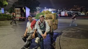 Street vendors selling produce outside Mayorista de Medellín.